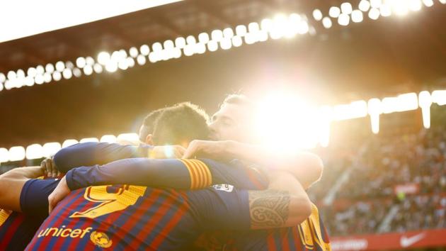 Barcelona’s Lionel Messi celebrates with team mates after scoring their third goal to complete his hat-trick during the Sevilla v FC Barcelona match at Ramon Sanchez Pizjuan in Seville, Spain. (Marcelo del Pozo / REUTERS) Barcelona’s Lionel Messi celebrates with team mates after scoring their third goal to complete his hat-trick during the Sevilla v FC Barcelona match at Ramon Sanchez Pizjuan in Seville, Spain. (Marcelo del Pozo / REUTERS)