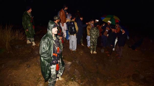 Pakistani soldiers and media personnel gather at the site of the IAF strike at Balakot. Pakistan’s defence spokesperson said that the pilot was being treated “as per norms of military ethics” Later Wednesday, Pakistan Prime Minister Imran Khan said the “sole purpose” of the morning strikes across LoC was to tell India that “if they can come here, we can go there too”. (Sajjad Qayyum / AFP)