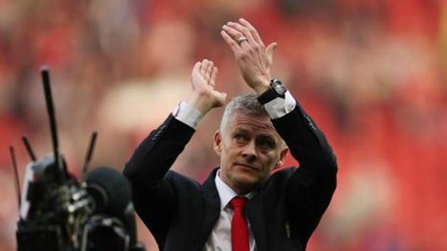 Manchester United coach Ole Gunnar Solskjaer applauds the fans at the end of a match.(Action Images via Reuters)