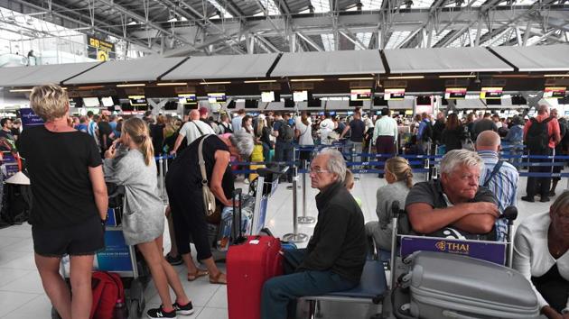 Stranded passengers wait at the check-in area at the Suvarnabhumi International Airport in Bangkok. (AFP) Stranded passengers wait at the check-in area at the Suvarnabhumi International Airport in Bangkok. (AFP)
