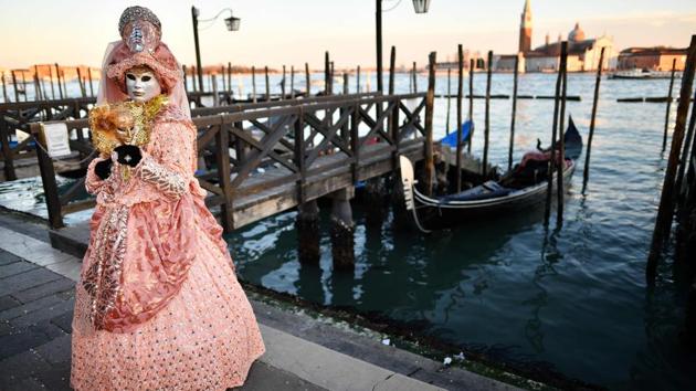 A reveller wearing a mask and a period costume takes part in the Venice Carnival in Venice, Italy. (Alberto Pizzoli / AFP) A reveller wearing a mask and a period costume takes part in the Venice Carnival in Venice, Italy. (Alberto Pizzoli / AFP)