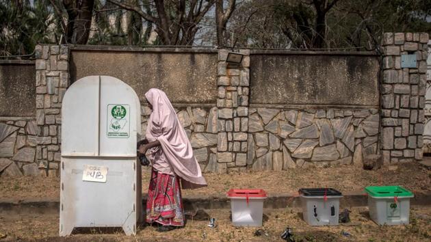 One of the first voters casts their ballots at Unguwar Sarki polling station in Kaduna, as Nigeria votes to elect its new president. (Cristina Aldehuela / AFP) One of the first voters casts their ballots at Unguwar Sarki polling station in Kaduna, as Nigeria votes to elect its new president. (Cristina Aldehuela / AFP)