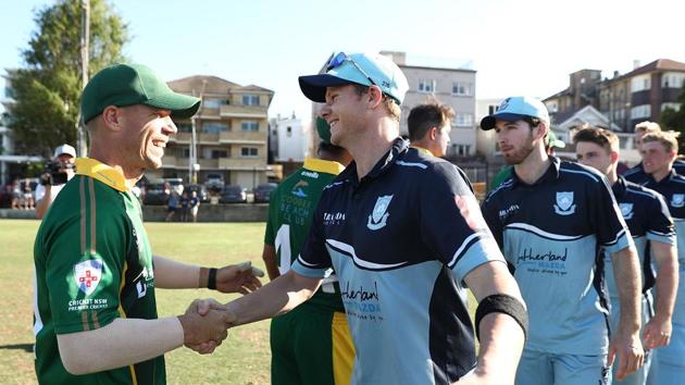 File image of David Warner (left) shaking hands with Steve Smith. (Getty Images) File image of David Warner (left) shaking hands with Steve Smith. (Getty Images)