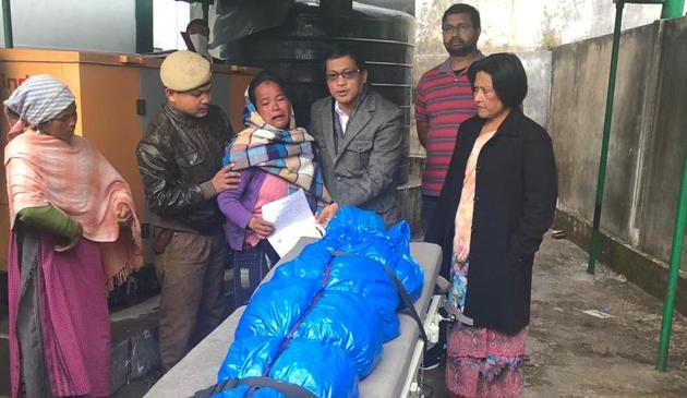 The body of Dimonme Dkhar being handed over to his mother by East Jaintia Hills Deputy Comissioner, FM Dopth on Friday. (HT PHOTO) The body of Dimonme Dkhar being handed over to his mother by East Jaintia Hills Deputy Comissioner, FM Dopth on Friday. (HT PHOTO)