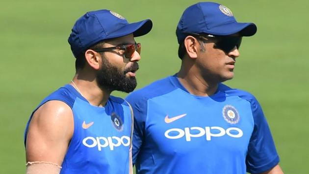 Virat Kohli (L) with Mahendra Singh Dhoni attend a training session.(AFP)