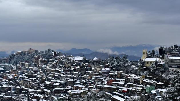A view of snow covered rooftops and trees after fresh snowfall, in Shimla, Himachal Pradesh. (Deepak Sansta / HT Photo) 