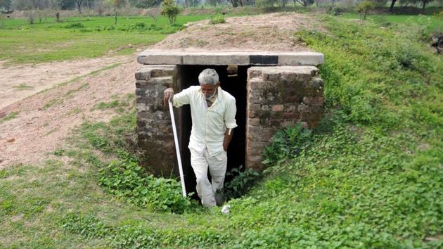 Jammu, India - February 28, 2019: A border villager comes out from a community bunker at Chandu Chak village of Ranbir Singh Pura sector near the India-Pakistan international border, about 35km from Jammu, Jammu and Kashmir, India on Thursday, February 28, 2019. (Photo by Nitin Kanotra / Hindustan Times) (HT photo) Jammu, India - February 28, 2019: A border villager comes out from a community bunker at Chandu Chak village of Ranbir Singh Pura sector near the India-Pakistan international border, about 35km from Jammu, Jammu and Kashmir, India on Thursday, February 28, 2019. (Photo by Nitin Kanotra / Hindustan Times) (HT photo)