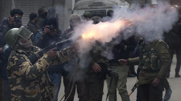 A paramilitary solider fires tear gas shell towards protesters in Srinagar, Jammu and Kashmir. (Dar Yasin / AP) 