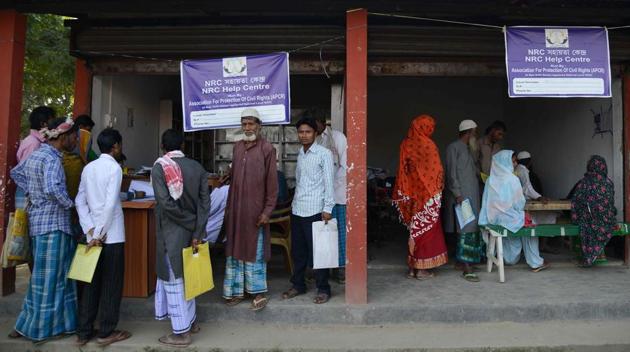 Villagers gather to check their documents at a National Register of Citizens (NRC) help centre for people whose names were not featured in the final draft of the NRC at Hatisola village in Kamrup district in Assam.(AFP)