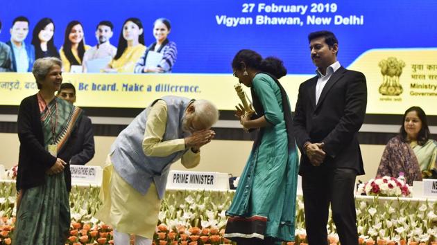 Prime Minister Narendra Modi gestures while presenting the 2nd prize to Anjanakshi MS of Karnataka during the National Youth Parliament Festival 2019 Awards at Vigyan Bhavan in New Delhi. (Mohd Zakir / HT Photo) 