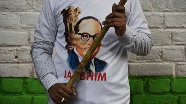 A man seen in a BR Ambedkar's face printed t-shirt during a protest against government at Jantar Mantar, in New Delhi. (Biplov Bhuyan / HT Photo) 