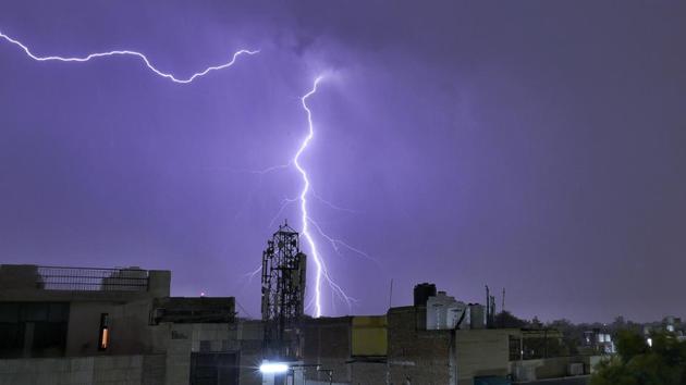 Strong lightning hit the skyline followed by heavy rain at Patel Nagar, in New Delhi. (Sanchit Khanna / HT Photo) 