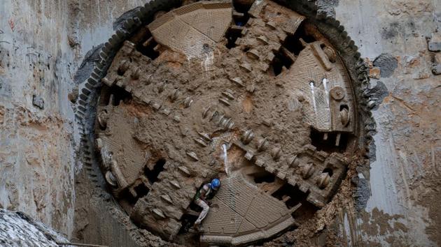 A construction worker comes through a Tunnel Boring Machine (TBM) breakthrough point after successfully building a tunnel for the metro train in Ahmedabad, Gujarat. (Amit Dave / REUTERS) 