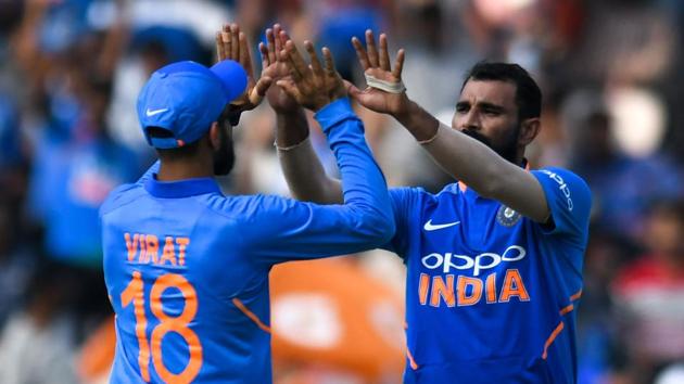 Indian cricketer Mohammed Shami (R) celebrates with his captain Virat Kohli (L) the dismissal of Australian cricketer Ashton Turner during the first one day international (ODI) cricket match between India and Australia.(AFP) Indian cricketer Mohammed Shami (R) celebrates with his captain Virat Kohli (L) the dismissal of Australian cricketer Ashton Turner during the first one day international (ODI) cricket match between India and Australia.(AFP)