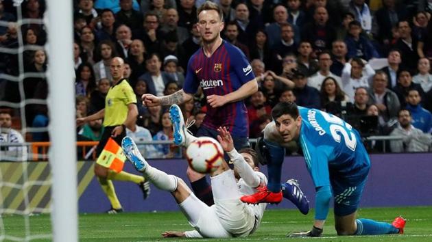 Ivan Rakitic scores Barcelona’s winning goal against Real Madrid on Saturday.(REUTERS)