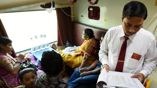 A Traveling Ticket Examiner (TTE) checks tickets in the train. “Women would dress in their best to travel in the Rajdhani. The men would often wear a tie for the journey,” recalls Debashis Chandra, group general manager (east zone), of the Indian Railway Catering and Tourism Corporation (IRCTC), whose father Ratan Chandra Chandra was the first catering manager of the Howrah Rajdhani. (Arijit Sen / HT Photo) A Traveling Ticket Examiner (TTE) checks tickets in the train. “Women would dress in their best to travel in the Rajdhani. The men would often wear a tie for the journey,” recalls Debashis Chandra, group general manager (east zone), of the Indian Railway Catering and Tourism Corporation (IRCTC), whose father Ratan Chandra Chandra was the first catering manager of the Howrah Rajdhani. (Arijit Sen / HT Photo)