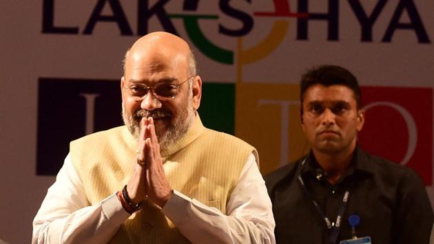 National president of BJP Amit Shah during the Jain International Trade Organization saluting and contributing to the families of martyrs, in Ahmedabad on March 3. (PTI Photo) National president of BJP Amit Shah during the Jain International Trade Organization saluting and contributing to the families of martyrs, in Ahmedabad on March 3. (PTI Photo)
