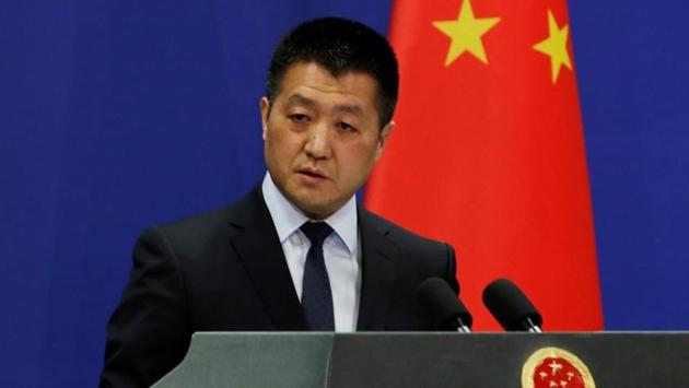 Chinese Foreign Ministry spokesman Lu Kang answers questions during a news conference in Beijing.(REUTERS)