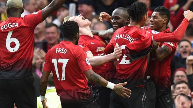 Manchester United's Belgian striker Romelu Lukaku (C) celebrates with teammates.(AFP)