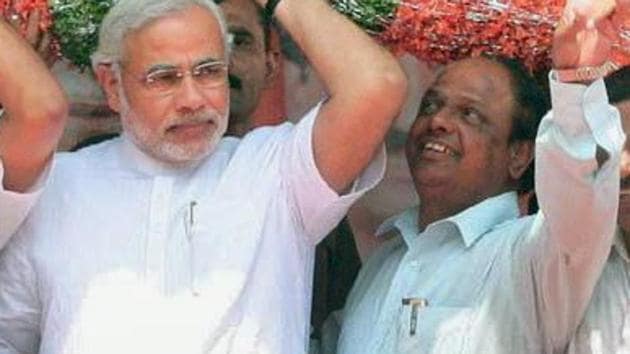File photo of Narendra Modi and V Dhananjay Kumar. (PTI) File photo of Narendra Modi and V Dhananjay Kumar. (PTI)