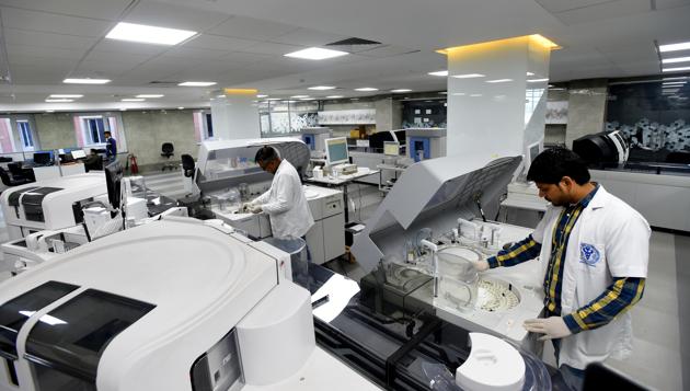 With its fully robotic automation track, standalone instrumentation and integrated workflow the Robotic Core Laboratory at NCI has a capacity to test 60,000 samples a day and run 24x7. It has an expanded menu of tests, including genetic screening for mutations and molecular diagnostic for personalised medicine, which does away with the need to send samples to peripheral labs. (Amal KS / HT Photo) With its fully robotic automation track, standalone instrumentation and integrated workflow the Robotic Core Laboratory at NCI has a capacity to test 60,000 samples a day and run 24x7. It has an expanded menu of tests, including genetic screening for mutations and molecular diagnostic for personalised medicine, which does away with the need to send samples to peripheral labs. (Amal KS / HT Photo)