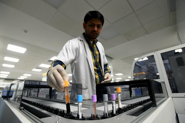 The automation also lowers manpower requirement and frees up technicians to work in shifts around the clock. Pneumatic chutes are used to propel containers with ampoules containing samples for testing between stations. We don’t have to waste time on sample transport, capping, sorting, sending reports and making registry entries,” said Dinesh Kumar, a lab technician. (Amal KS / HT Photo) The automation also lowers manpower requirement and frees up technicians to work in shifts around the clock. Pneumatic chutes are used to propel containers with ampoules containing samples for testing between stations. We don’t have to waste time on sample transport, capping, sorting, sending reports and making registry entries,” said Dinesh Kumar, a lab technician. (Amal KS / HT Photo)