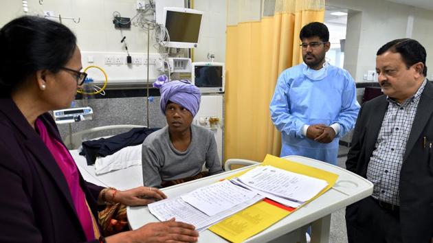 Dr Sushma Bhatnagar (left) and Dr SVS Deo with a cancer patient, Manoj Ram from Bihar, at National Cancer Institute (NCI), Jhajjar on March 1.(Amal KS / HT PHOTO)