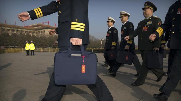 Military delegates arrive for a meeting on the eve of the opening session. Spending on the Communist Party’s military wing, the People’s Liberation Army, will rise to 1.2 trillion yuan ($178 billion), according to a separate report issued by the finance ministry. “It is more urgent for China to prepare for a trade war with the US, instead of a physical war,” Yue Gang, a military expert and retired army colonel said. (Mark Scheifelbein / AP) Military delegates arrive for a meeting on the eve of the opening session. Spending on the Communist Party’s military wing, the People’s Liberation Army, will rise to 1.2 trillion yuan ($178 billion), according to a separate report issued by the finance ministry. “It is more urgent for China to prepare for a trade war with the US, instead of a physical war,” Yue Gang, a military expert and retired army colonel said. (Mark Scheifelbein / AP)