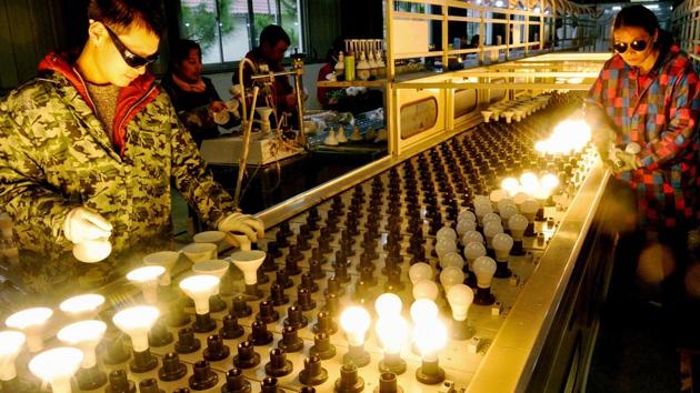Workers check lightbulbs that will be exported to the US at a factory in Wannian. To combat slowing growth, policymakers have said they will lower taxes, reduce fees and streamline red tape. China will cut company taxes and employer social insurance contributions paid on behalf of workers by nearly 2 trillion yuan ($298 billion), Li said. (AFP) Workers check lightbulbs that will be exported to the US at a factory in Wannian. To combat slowing growth, policymakers have said they will lower taxes, reduce fees and streamline red tape. China will cut company taxes and employer social insurance contributions paid on behalf of workers by nearly 2 trillion yuan ($298 billion), Li said. (AFP)