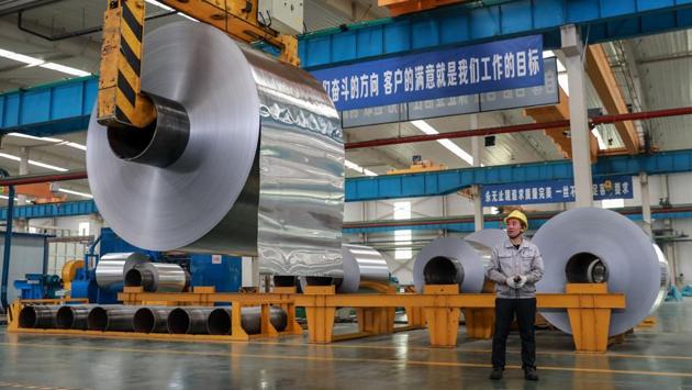 A worker looks at rolls of sheet aluminium at a factory in Huaibei. “They need to strike a balance between boosting economic activity and not restart another debt-fuelled boom,” said Tai Hui of JP Morgan Asset Management. Beijing is determined to achieve above six percent growth for the next two years to “meet its promise” of doubling GDP for the decade ending 2020, said Lu Ting, an analyst at Nomura bank. (AFP) A worker looks at rolls of sheet aluminium at a factory in Huaibei. “They need to strike a balance between boosting economic activity and not restart another debt-fuelled boom,” said Tai Hui of JP Morgan Asset Management. Beijing is determined to achieve above six percent growth for the next two years to “meet its promise” of doubling GDP for the decade ending 2020, said Lu Ting, an analyst at Nomura bank. (AFP)