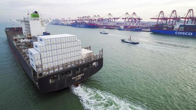 A container ship sails past a port in Qingdao in eastern China’s Shandong province. To support growth, Li said China would closely monitor employment at exporting companies heavily exposed to the US market and cut the value-added tax (VAT) for the manufacturing sector to 13% from 16%. VAT for the transport and construction sectors will be cut to 9% from 10%. (Chinatopix via AP) A container ship sails past a port in Qingdao in eastern China’s Shandong province. To support growth, Li said China would closely monitor employment at exporting companies heavily exposed to the US market and cut the value-added tax (VAT) for the manufacturing sector to 13% from 16%. VAT for the transport and construction sectors will be cut to 9% from 10%. (Chinatopix via AP)