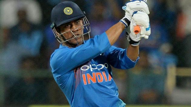 MS Dhoni plays a shot during the second T20 between India and Australia.(AFP)
