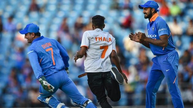 MS Dhoni runs away from a pitch-invader during the 2nd ODI. (PTI) MS Dhoni runs away from a pitch-invader during the 2nd ODI. (PTI)