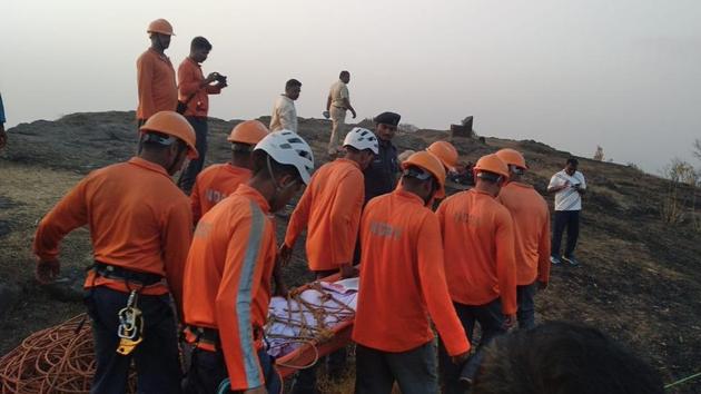 A Batallion-5 team of the National Disaster Rescue Force (NDRF) from the Sudumbare area of Pune was called in a day after rescue efforts by local trekking groups and police failed (HT PHOTO) A Batallion-5 team of the National Disaster Rescue Force (NDRF) from the Sudumbare area of Pune was called in a day after rescue efforts by local trekking groups and police failed (HT PHOTO)