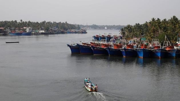 Fishermen travel in a boat in the tributary waters of the Periyar River in Kerala. The Kerala government is now giving three-hour afternoon siestas to labourers to help improve labour conditions in the summers. (REUTERS) Fishermen travel in a boat in the tributary waters of the Periyar River in Kerala. The Kerala government is now giving three-hour afternoon siestas to labourers to help improve labour conditions in the summers. (REUTERS)