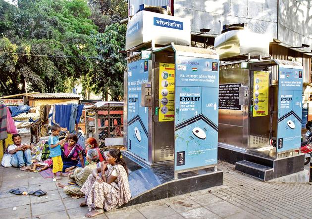 E-toilets wear a deserted look on JM road with squatters taking up the corner, making the area near it dirty.(Sanket Wankhade/HT PHOTO)