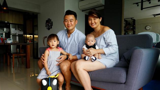 Public relations account director Peiru Ng, with her husband, their two-and-a-half year old daughter Faith and 12-week-old son Scott in Singapore. Singaporean mothers are by and large entitled to 16 weeks of paid maternity leave while fathers are allowed two weeks of leave. Peiru chose to end her maternity leave after 12 weeks. “Having my work is like having me time. I feel that work makes me a better mum,” she said. (Feline Lim / REUTERS) Public relations account director Peiru Ng, with her husband, their two-and-a-half year old daughter Faith and 12-week-old son Scott in Singapore. Singaporean mothers are by and large entitled to 16 weeks of paid maternity leave while fathers are allowed two weeks of leave. Peiru chose to end her maternity leave after 12 weeks. “Having my work is like having me time. I feel that work makes me a better mum,” she said. (Feline Lim / REUTERS)