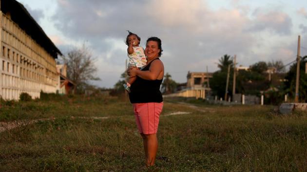 Evelin Naranjo, a teacher at a kindergarten, holds her one-year old daughter Victoria in the week she went back to work, in Las Tunas, Cuba. Statutory maternity leave in Cuba is one year and it can be taken by either mother or father. Evelin was off for 52 weeks. “It's a huge effort for me not to be able to see my daughter due to my work, but I do it for her own good,” she said. (Fernando Medina / REUTERS) Evelin Naranjo, a teacher at a kindergarten, holds her one-year old daughter Victoria in the week she went back to work, in Las Tunas, Cuba. Statutory maternity leave in Cuba is one year and it can be taken by either mother or father. Evelin was off for 52 weeks. “It's a huge effort for me not to be able to see my daughter due to my work, but I do it for her own good,” she said. (Fernando Medina / REUTERS)