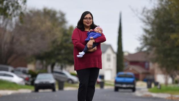 Blanca Eschbach with her daughter Olivia on her first day back at work after a 10-week maternity leave in San Antonio, Texas. “I’m just now getting...to know her and her routine and her cues, and now I have to turn her over to these strangers to help me raise her while I’m at work”, Blanca said. “I feel like I’m...missing out on her during this very important time.” The US does not guarantee paid family leave to its citizens. (Callaghan O'Hare / REUTERS) Blanca Eschbach with her daughter Olivia on her first day back at work after a 10-week maternity leave in San Antonio, Texas. “I’m just now getting...to know her and her routine and her cues, and now I have to turn her over to these strangers to help me raise her while I’m at work”, Blanca said. “I feel like I’m...missing out on her during this very important time.” The US does not guarantee paid family leave to its citizens. (Callaghan O'Hare / REUTERS)