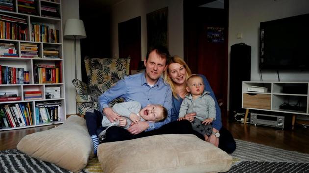 Marlena Mucha, her husband and sons Borys, 4, and Julek, 1, at their apartment in Warsaw, Poland. In Poland, an employed woman can take to 52 weeks of paid leave after the birth of a child, and be paid around 80% of her salary. “For the first month I will work only 4-5 hours daily. This way the process of leaving my son, will be more gradual. So I will have some time to get used to it,” Marlena said. (Kacper Pempel / REUTERS) Marlena Mucha, her husband and sons Borys, 4, and Julek, 1, at their apartment in Warsaw, Poland. In Poland, an employed woman can take to 52 weeks of paid leave after the birth of a child, and be paid around 80% of her salary. “For the first month I will work only 4-5 hours daily. This way the process of leaving my son, will be more gradual. So I will have some time to get used to it,” Marlena said. (Kacper Pempel / REUTERS)