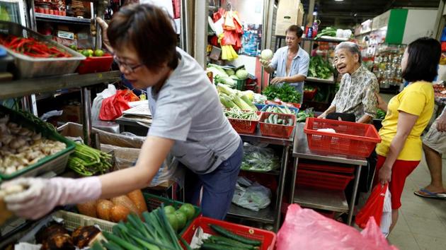 Leong Yuet Meng does her daily shopping for ingredients. Celebrity chefs Anthony Bourdain and Gordon Ramsay have effused over typically Singaporean dishes like chicken rice; some hawker stalls serve up the cheapest Michelin star meals at $2; and last year’s Hollywood hit film Crazy Rich Asians showed its stars tucking into heaped plates at a famous Singapore night market. (Edgar Su / REUTERS)
