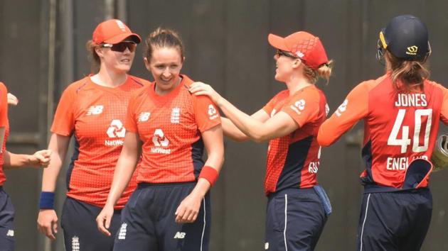 Guwahati: England players celebrate the dismissal of India's Mithali Raj during the 2nd T20 international cricket match at Barsapara Cricket Stadium.(PTI)