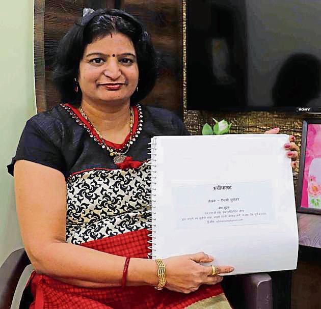 Aishwarya Punekar shows her cookbook on Thursday.(Rishikesh Choudhary/HT)
