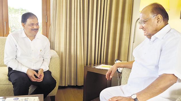 Pravin Gaikwad (left) recently met Sharad Pawar at the NCP chief’s residence in Baramati, sparking speculation that Gaikwad, the former president of the Sambhaji Brigade, was in the running for the Pune Lok Sabha seat.(HT Photo)