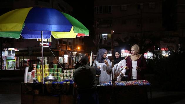 Women buy snacks from a vendor. Yaghi’s party-planning requires her to stay up late at night. She said she sometimes hears some of her neighbours, who view her work as inappropriate, passing comments. “I hate some comments. But I love my job and hope to have my own business,” Yaghi said, adding she wants to become the “first female party planner” in Gaza. (Samar Abo Elouf / REUTERS) Women buy snacks from a vendor. Yaghi’s party-planning requires her to stay up late at night. She said she sometimes hears some of her neighbours, who view her work as inappropriate, passing comments. “I hate some comments. But I love my job and hope to have my own business,” Yaghi said, adding she wants to become the “first female party planner” in Gaza. (Samar Abo Elouf / REUTERS)