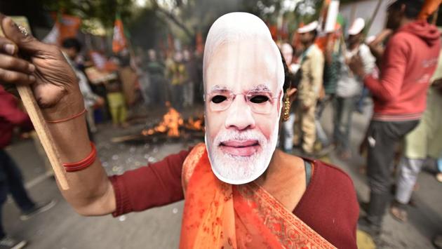 A Dalit morcha activist seen wearing Prime Minister Narendra Modi's face mask during a protest, at Jantar Mantar, in New Delhi. (Raj K Raj / HT Photo) A Dalit morcha activist seen wearing Prime Minister Narendra Modi's face mask during a protest, at Jantar Mantar, in New Delhi. (Raj K Raj / HT Photo)