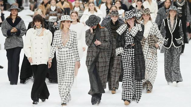 Model Cara Delevingne (2ndL), looks as models wipe tears from their eyes as they wear creations as part of the Chanel ready to wear Fall-Winter 2019-2020 collection, that was presented in Paris, France. It was Karl Lagerfeld's final curtain — even though he was missing. (Francois Mori / AP) 