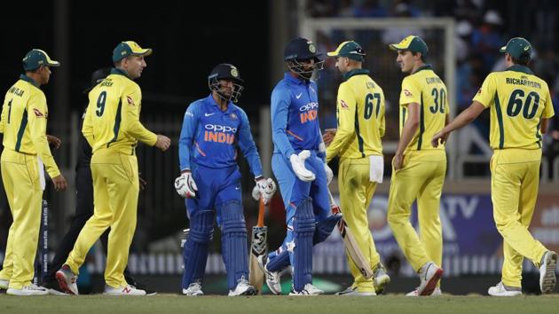 Australian players greet Indian the last two Indian batsmen after their win. (AP) Australian players greet Indian the last two Indian batsmen after their win. (AP)