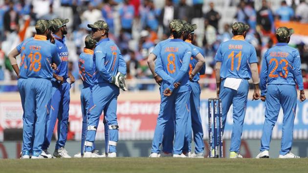 Indian players sport camouflage caps as they wait for a decision during the third ODI cricket match between India and Australia in Ranchi. Members and the support staff of Indian cricket team wore the caps as a mark of tribute to the paramilitary soldiers killed in suicide car bombing in Kashmir last month and to encourage all donations to the National Defence Fund. (Aijaz Rahi / AP) Indian players sport camouflage caps as they wait for a decision during the third ODI cricket match between India and Australia in Ranchi. Members and the support staff of Indian cricket team wore the caps as a mark of tribute to the paramilitary soldiers killed in suicide car bombing in Kashmir last month and to encourage all donations to the National Defence Fund. (Aijaz Rahi / AP)