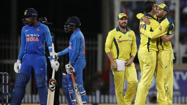 Australia players, right, celebrate their win in the third ODI between India and Australia in Ranchi.(AP)